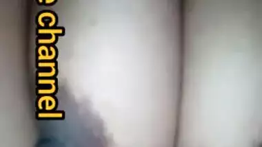 Naughty Desi woman squeezes tits to lick nipples in the porn video